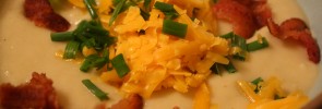 Potato leek soup with bacon and cheese topping