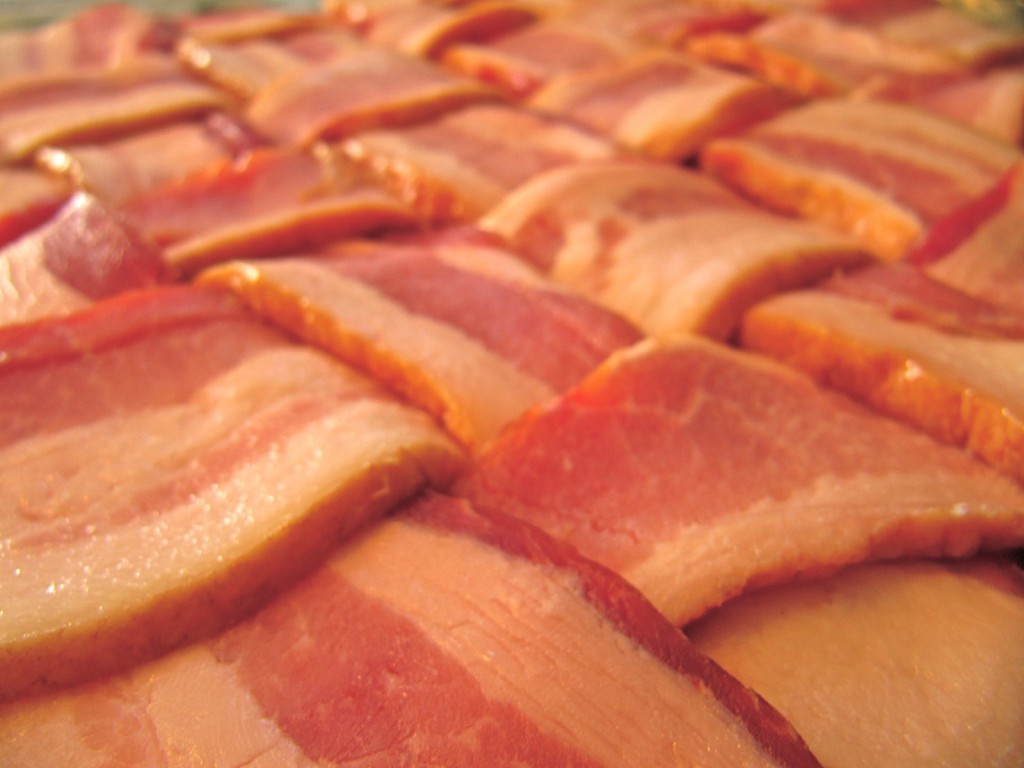 A raw bacon weave, ready to be wrapped around something