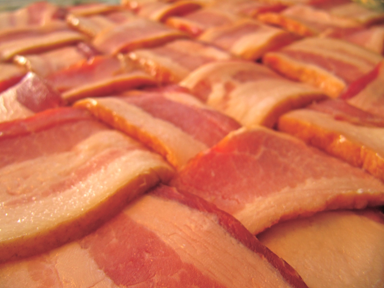 A raw bacon weave, ready to be wrapped around something
